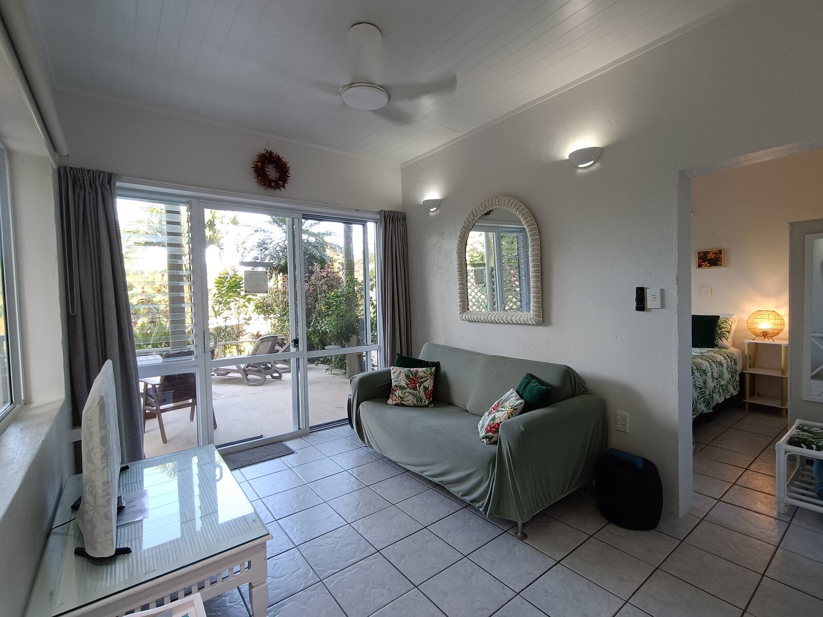Bright Kaute lounge with veranda and garden views