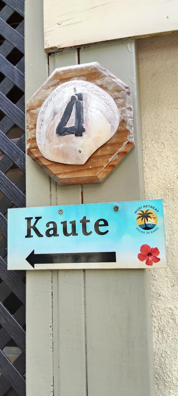 Kaute apartment sign with the Muri Retreat logo