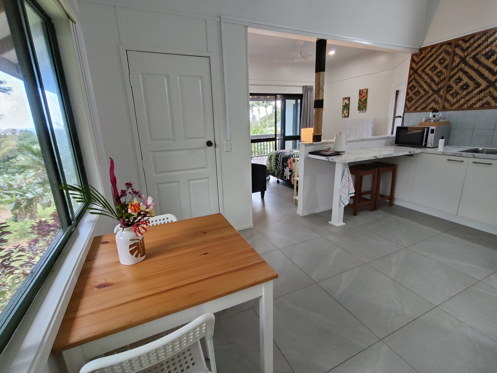 Kukupa dining area with lagoon and garden outlook