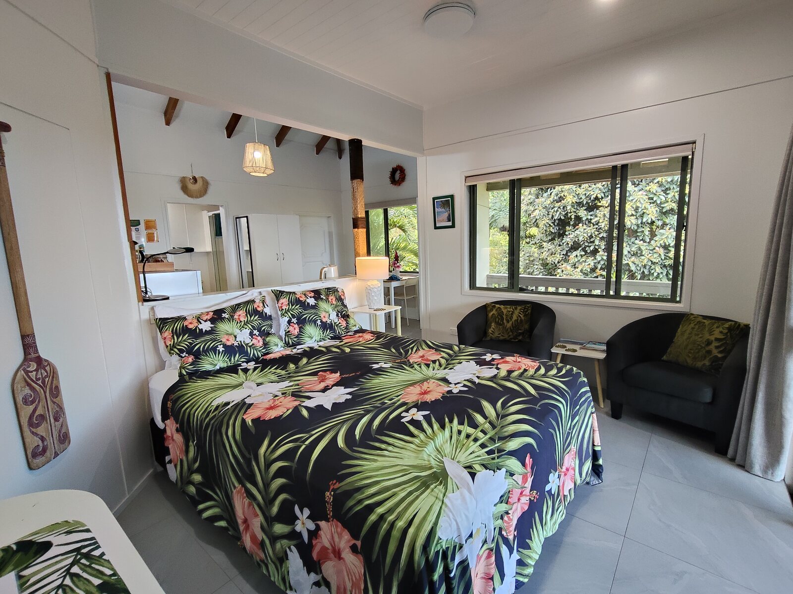 Kukupa queen bedroom with tropical garden window view